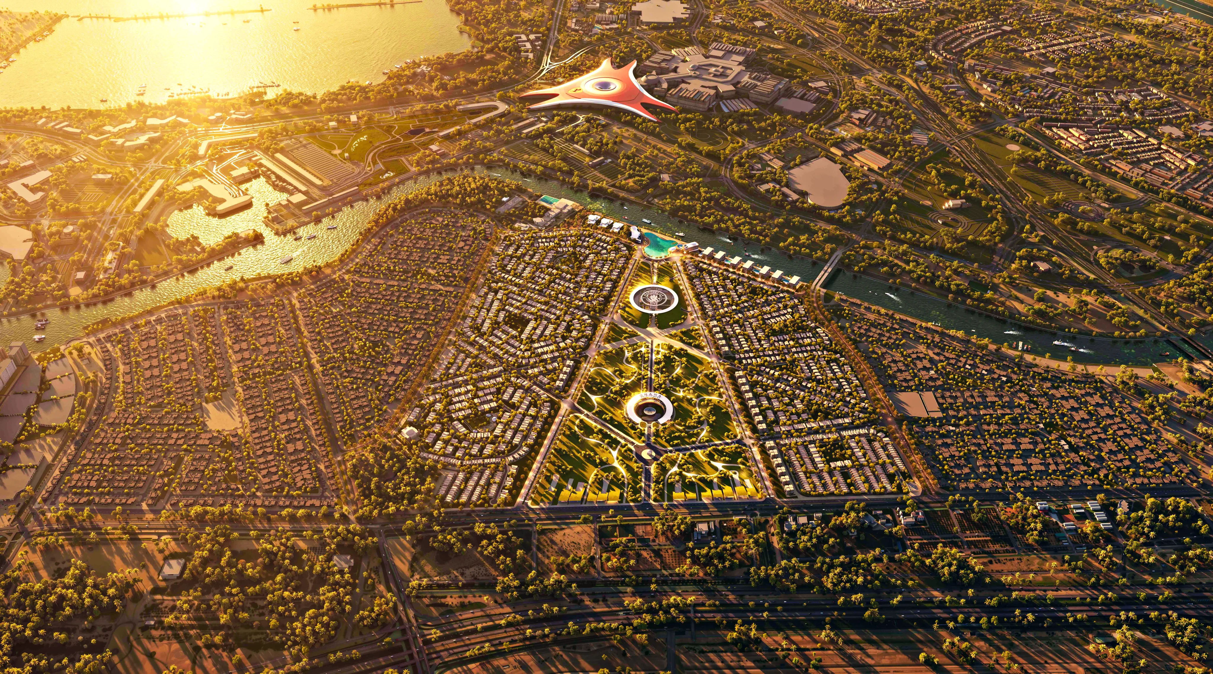 Aerial view of Manchester City Yas Residences by Ohana at golden hour, with Yas Island beyond the canal